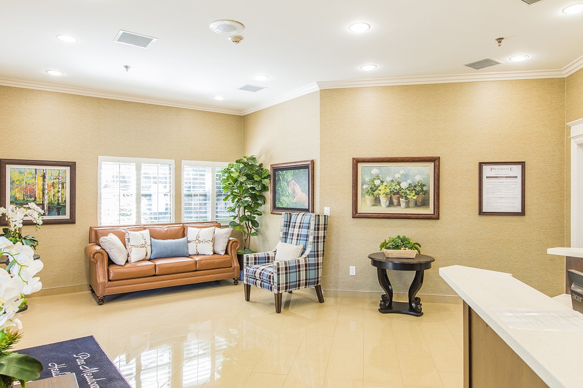 Common area with soft seating at Pine Meadows Post Acute