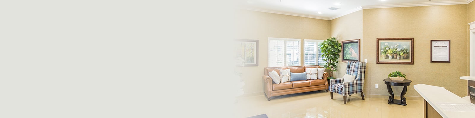 Common area with soft seating at Pine Meadows Post Acute